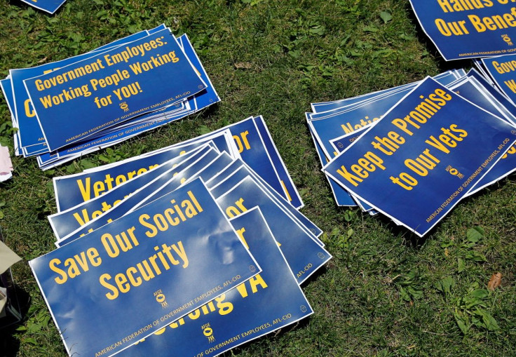 Signs are pictured on the ground during a noon-time rally of federal employees on Independence Mall to protest proposed cuts in federal funding in Philadelphia, Pennsylvania, U.S., June 22, 2017. 