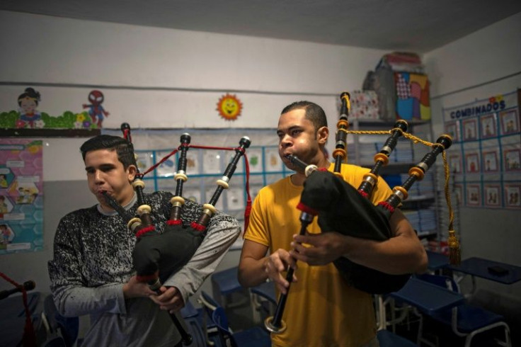 Bagpipe master Jhonny Mesquita (R), 32, plays alongside one of his students during a rehearsal at the Vieira Brum School in Sao Goncalo, Brazil