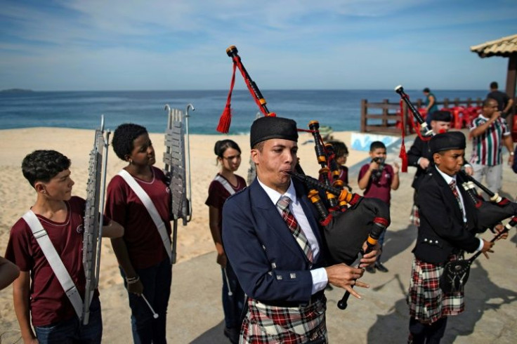 Bagpipe students, members of the Vieira Brum music band, play at the Marica beach in Brazil, on May 28, 2022