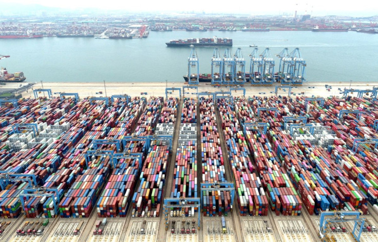 An aerial view shows containers and cargo vessels at the Qingdao port in Shandong province, China May 9, 2022. Picture taken with a drone. China Daily via REUTERS