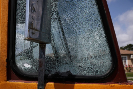 The window of a vehicle with the "Ghetto Life" motorcycle club sits shattered with a bullet hole, at the scene of a shooting where two people were shot dead and five wounded according to local media reports on Sunday, in the Willowbrook community of Los A