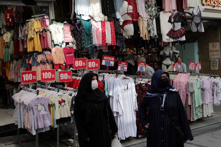 People stroll at Mahmutpasa street, a middle-class shopping area, in Istanbul, Turkey May 6, 2022.