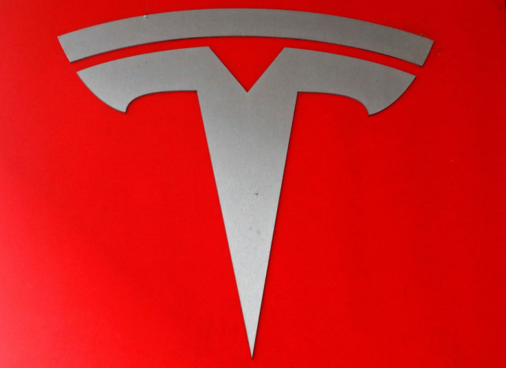 The company logo is seen in front of a showroom of U.S. car manufacturer Tesla in Zurich, Switzerland March 28, 2018.    