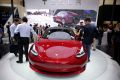 A Tesla Model 3 car is displayed during a media preview at the Auto China 2018 motor show in Beijing