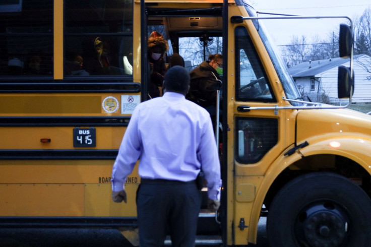 A teacher welcomes students back to classes after receiving the coronavirus disease (COVID-19) vaccination, at Westwood Elementary School in Dayton, Ohio, U.S., March 1, 2021. 