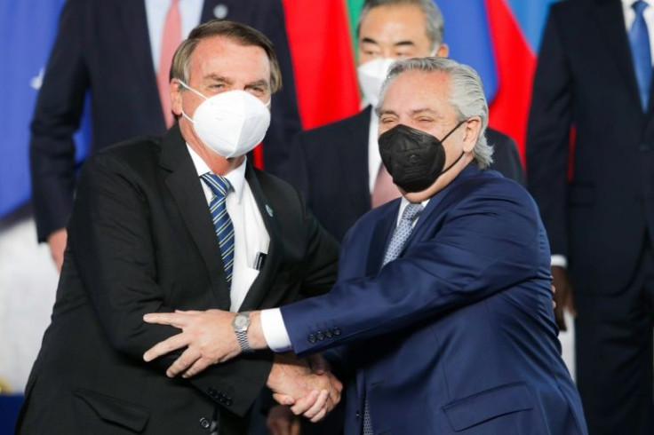 Argentine President Alberto Fernandez (right) and Brazilian President Jair Bolsonaro, seen at a Group of 20 summit in Rome in October 2021, will both attend the Summit of the Americas in Los Angeles