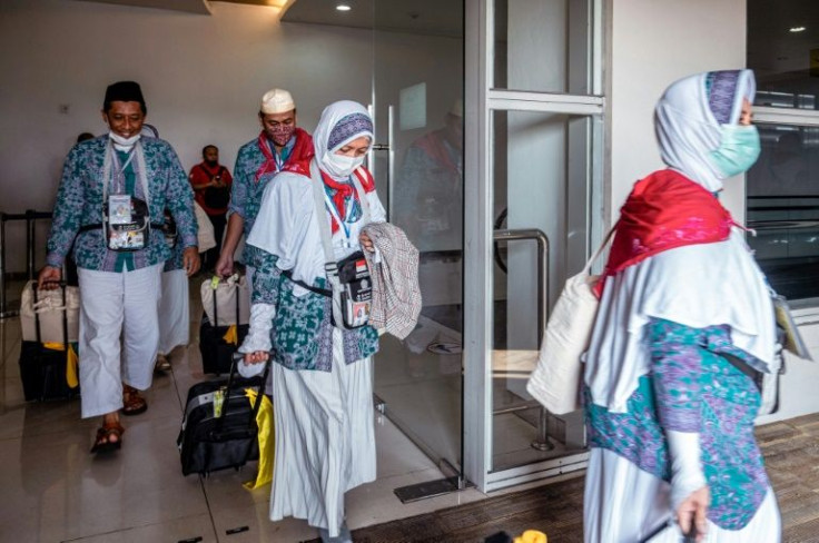 Indonesians prepare to depart from Juanda International Airport in Surabaya, as part of the first batch of hajj pilgrims since before the coronavirus pandemic
