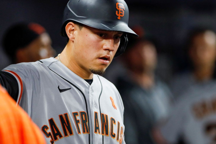 Jun 3, 2022; Miami, Florida, USA; San Francisco Giants first baseman Wilmer Flores (41) celebrates in the dugout after scoring during the first inning against the Miami Marlins at loanDepot Park. Mandatory Credit: Sam Navarro-USA TODAY Sports