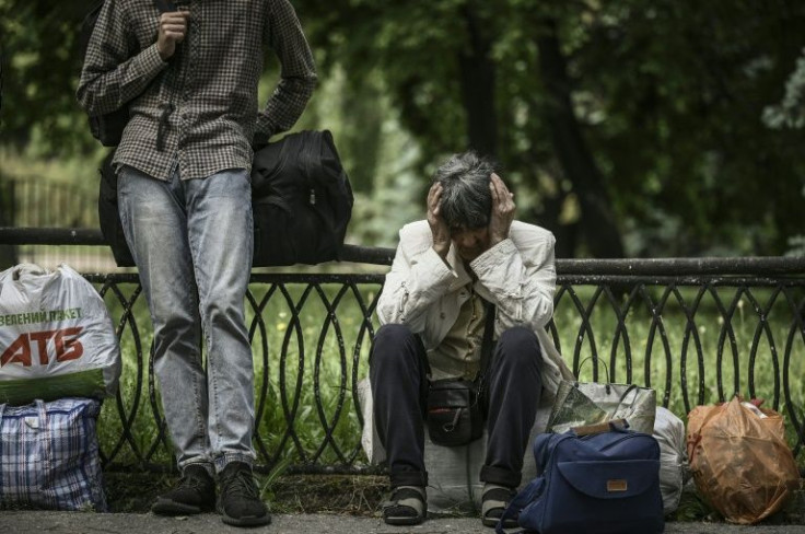 Residents wait to evacuate the city of Sloviansk, to the west of Severodonetsk, on June 2