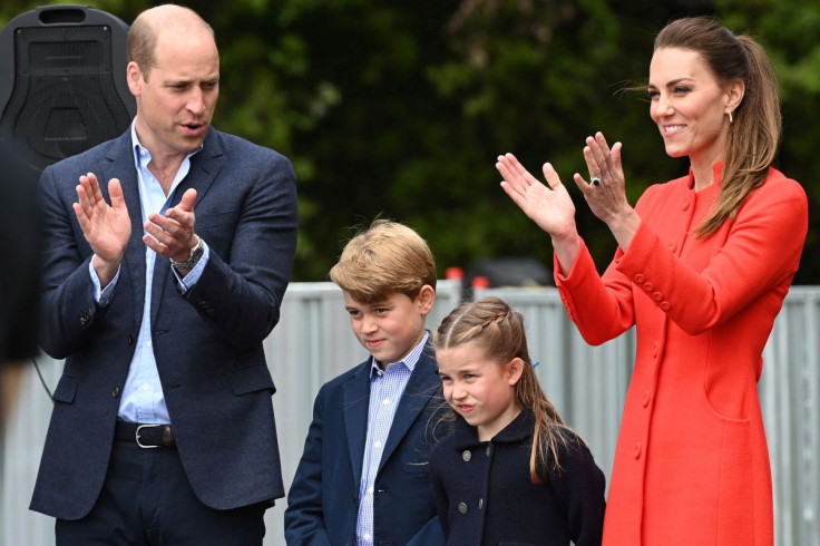 Britain's Prince William and Catherine, Duchess of Cambridge applaud a rehearsal during their visit  to the Cardiff Castle with their children Prince George and Princess Charlotte as part of the royal family's tour for Queen Elizabeth's Platinum Jubilee c