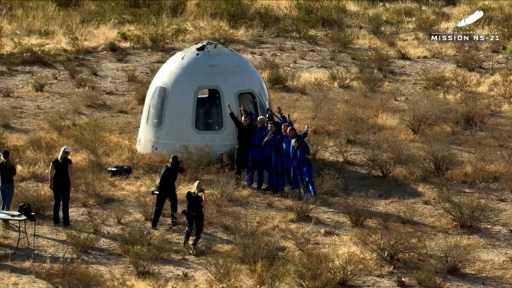 The occupants of Blue Origin's fifth crewed capsule mission pose for photographs after landing near Van Horn, Texas, U.S. June 4, 2022 in a still image from video. Blue Origin/Handout via REUTERS.  