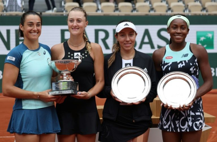 Doubles duty: France's Caroline Garcia and France's Kristina Mladenovic pose with the doubles trophy