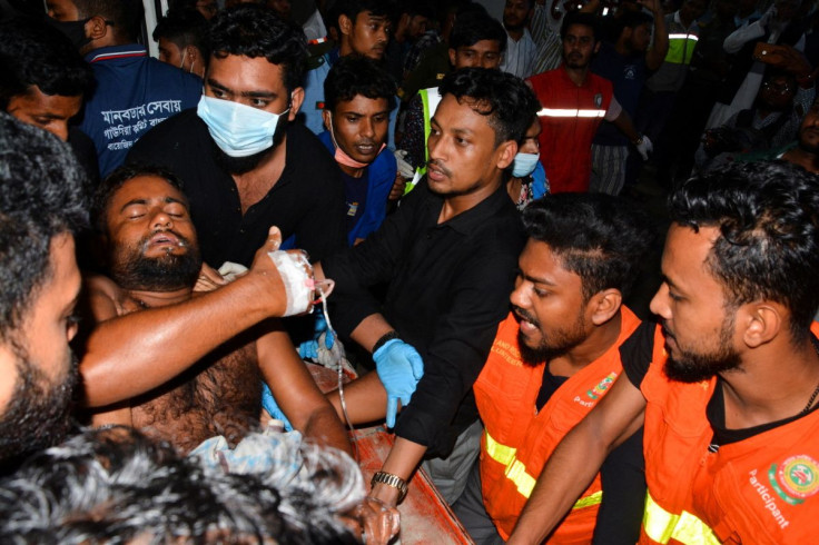 An injured victim is brought to a hospital after a massive fire broke out in an inland container depot at Sitakund, near the port city Chittagong, Bangladesh, June 5, 2022.
