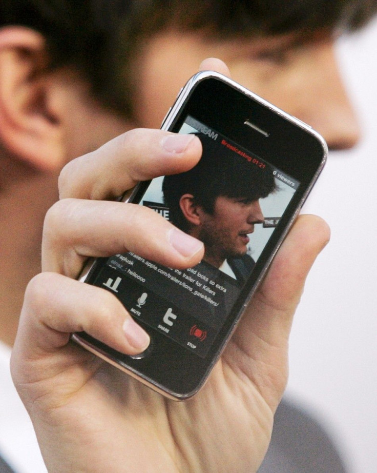 Actor Ashton Kutcher records himself on his iPhone as he arrives at the premiere of &quot;The Joneses&quot; in Los Angeles, California