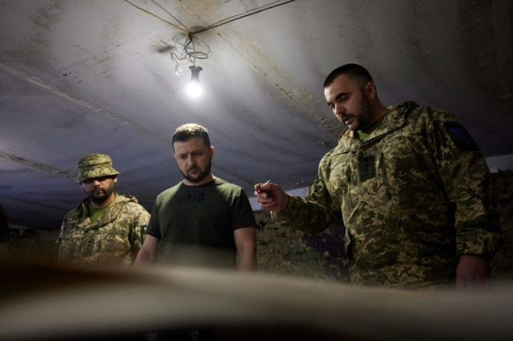 President Volodymyr Zelensky (centre) 'got himself acquainted with the operational situation on the front line of defence', the presidency said