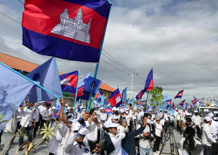 Supporters of the opposition party, Candlelight Party, wave flags as they take part in a campaign rally for the upcoming local elections on June 5, in Phnom Penh, Cambodia May 21, 2022.