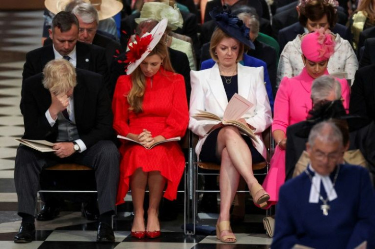 Boris Johnson (L) was booed by some in the crowd when he arrived at St Paul's Cathedral with wife Carrie on Friday
