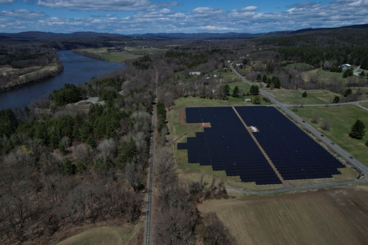 Solar panels are arrayed on Earth Day in Northfield, Massachusetts, U.S., April 22, 2022. Picture taken with a drone. 