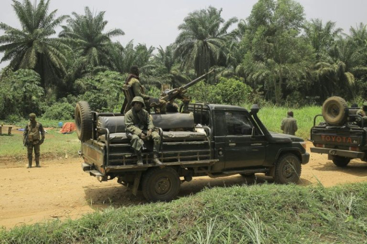 DR Congo troops pictured in March on a key road between Ituri and North Kivu that has been repeatedly attacked by the ADF