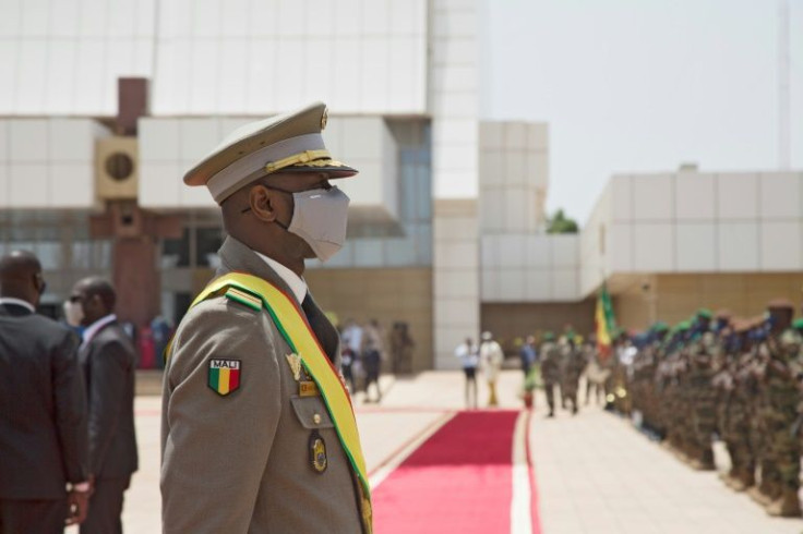 Junta leader Colonel Assimi Goita looks on at members of the Malian Armed Forces after his swearing in ceremony in Bamako in June 2021