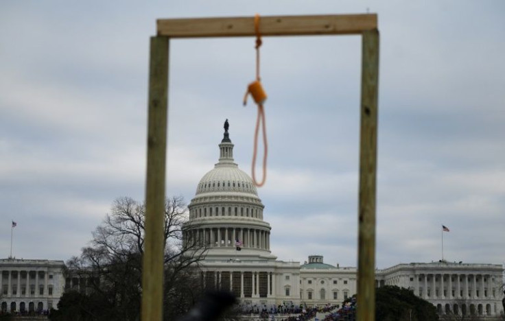 A noose is seen on makeshift gallows as supporters of Donald Trump enter the Capitol chanting "Hang Mike Pence!"