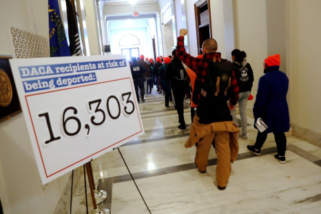 Demonstrators calling for new protections for so-called "Dreamers," undocumented children brought to the U.S. by their immigrant parents, walk through a Senate office building on Capitol Hill in Washington, U.S. January 17, 2018.  