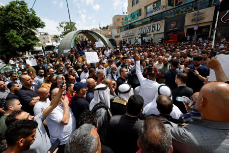 Palestinians shout slogans during a protest against rising of prices, in Hebron, in the Israeli-occupied West Bank, June 5, 2022. 