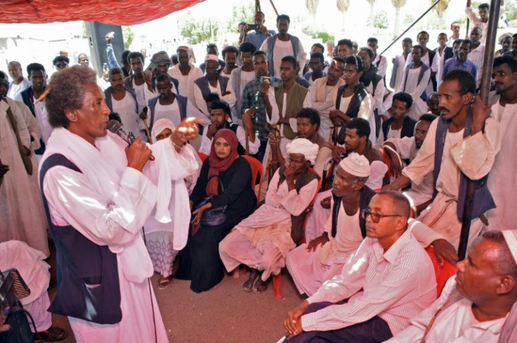 Beja protesters stage a sit-in outside the secretariat general of Red Sea state's government, in the city of Port Sudan on June 7, 2022, before the governor resigned