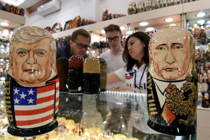 Traditional Russian wooden nesting dolls depicting former US President Donald Trump (L) and Russia's President Vladimir Putin (R)