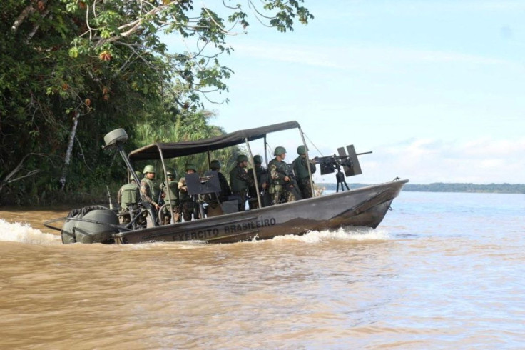 A search team looks for British journalist Dom Phillips and indigenous expert Bruno Pereira, who went missing while reporting in a remote and lawless part of the Amazon rainforest near the border with Peru, in Javari Valley, Brazil, June 5, 2022 in this s