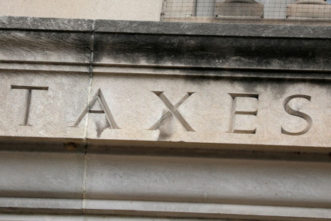 The word "taxes" is seen engraved at the headquarters of the Internal Revenue Service (IRS) in Washington, D.C., U.S., May 10, 2021. 