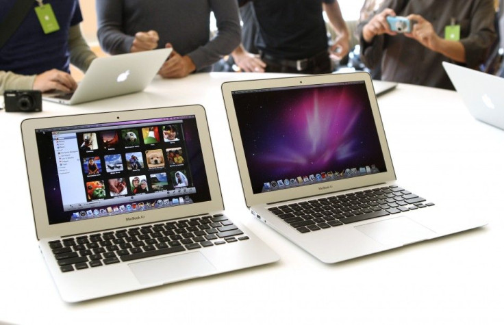 Media and guests check out the latest MacBook Air models and new operating system after attending a news conference in Cupertino