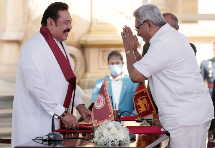 Sri Lanka's former prime minister Mahinda Rajapaksa (L) and his brother, President Gotabaya Rajapaksa, are seen in this picture taken in Colombo, Sri Lanka, August 9, 2020. 