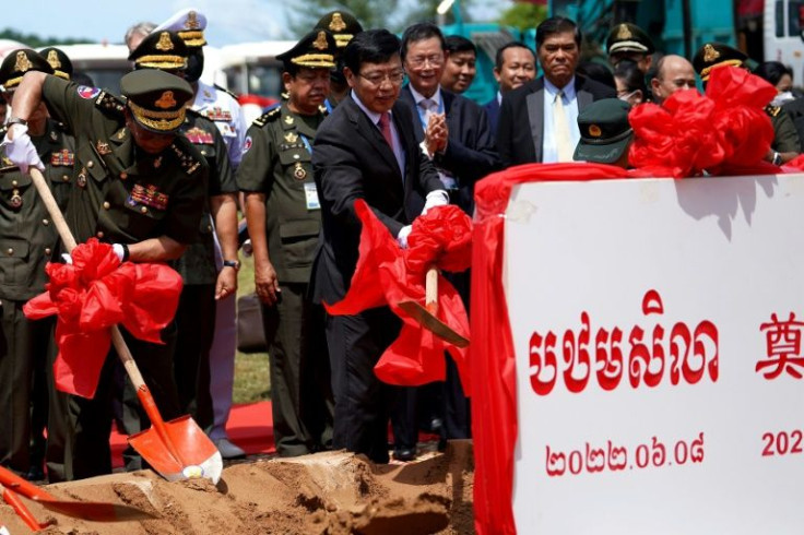 Cambodia's defence minister Tea Banh (L) and China's ambassador to Cambodia Wang Wentian (C) take part in the groundbreaking ceremony at the Ream naval base