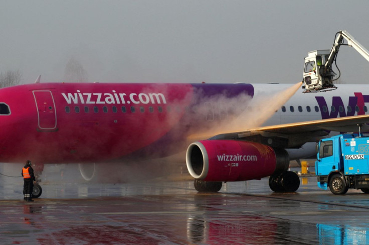 A Wizz Air plane is de-iced before flight at the Chopin International Airport in Warsaw February 6, 2012.