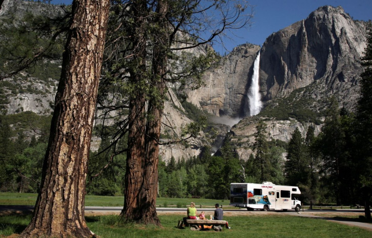 A family has a picnic in view of Upper Yosemite Falls in Yosemite National Park, California May 17, 2009. 