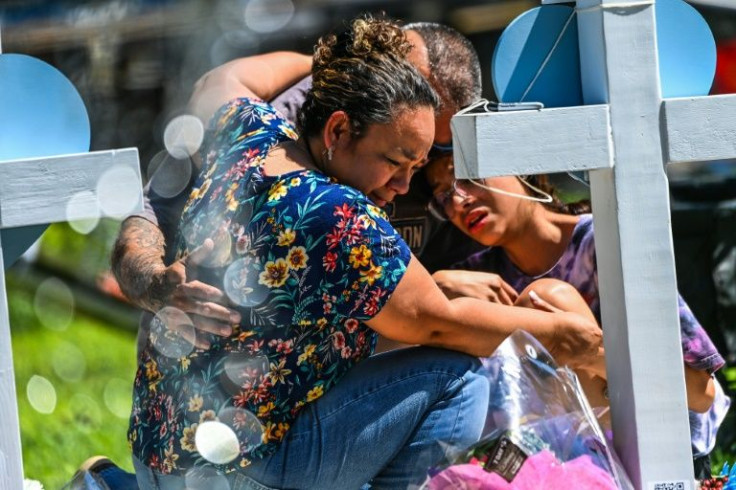 Mourners gather at a memorial in Uvalde, Texas on May 26, 2022 after a gunman murdered 19 children and two teachers at an elementary school