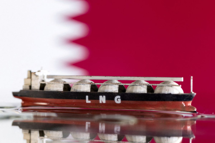 Model of LNG tanker is seen in front of Qatar's flag in this illustration taken May 19, 2022.