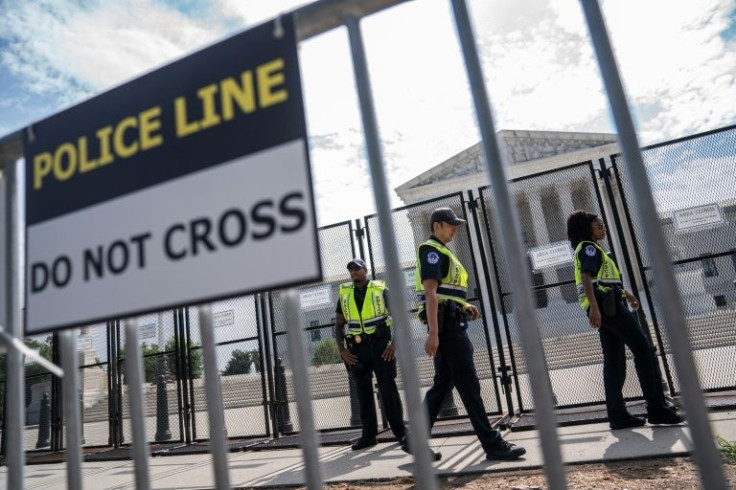 US Capitol Police and a security fence protecting the Supreme Court