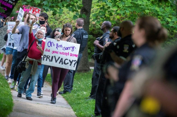 Abortion rights advocates demonstrate outside the home of US Supreme Court Chief Justice John Roberts in Chevy Chase, Maryland