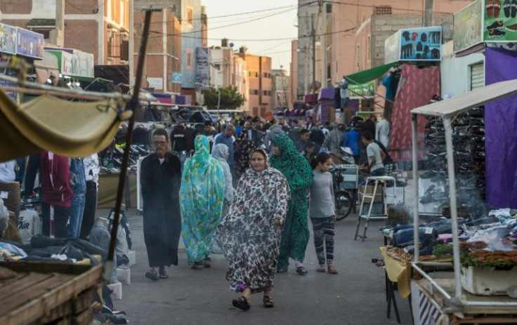 People walk along a market street in Western Sahara's main city of Laayoune in November 2018