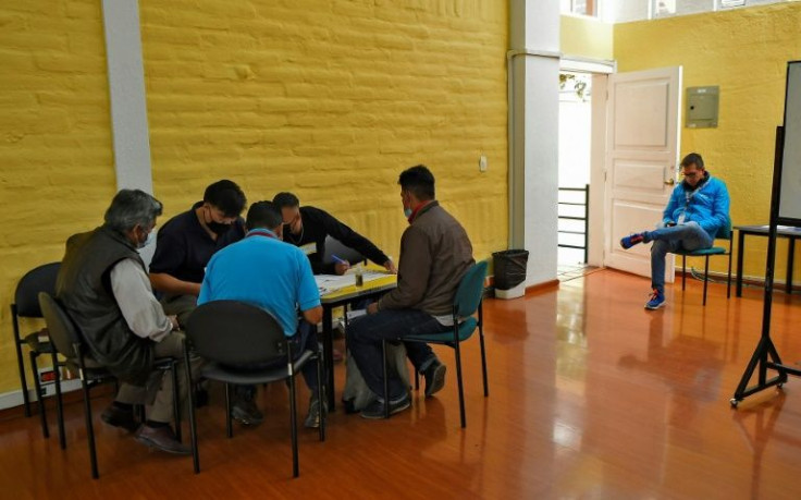 Attendees at the "Men's Club for Good Treatment" in Quito, Ecuador, practice techniques on how to manage their anger