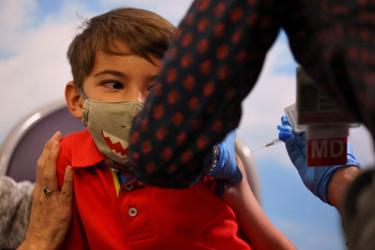 Five year-old Milo from Chula Vista, California, receives the Pfizer-BioNTech coronavirus vaccine at Rady's Children's hospital vaccination clinic in San Diego, California, U.S., November 3, 2021.