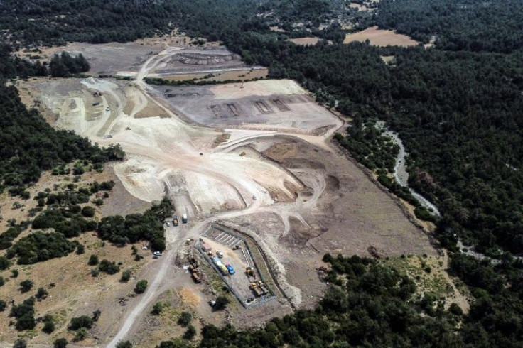 Greek critics say the camp -- on the edge of a dense pine forest in the middle of nowhere -- is a potential hazard of major proportions