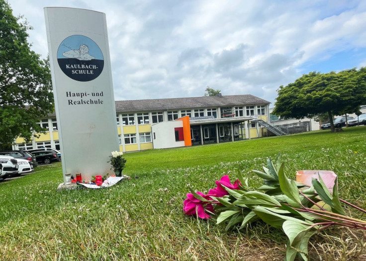 Candles and flowers are placed in front of the Kaulbach secondary school in Bad Arolsen following a car crashing into a group of Berlin visitors of the Kaulbach school killing one teacher and injuring several pupils near Breitscheidplatz, in Berlin on Jun
