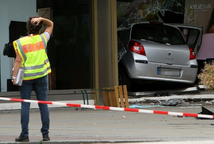The suspect's rampage ended with him crashing r through the front of a perfume shop