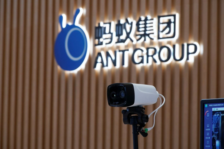 A thermal imaging camera is seen in front of a logo of Ant Group at the headquarters of Ant Group, an affiliate of Alibaba, in Hangzhou, Zhejiang province, China October 29, 2020. Picture taken October 29, 2020.