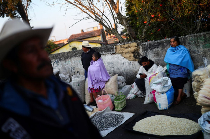 People sell corn grains at a public market in Ozumba de Alzate, State of Mexico, Mexico, May 24, 2022.