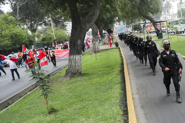 Police officers stand guard during a protest of the workers of the Las Bambas mine against the suspension of the mine, in Lima, Peru, June 2, 2022. 