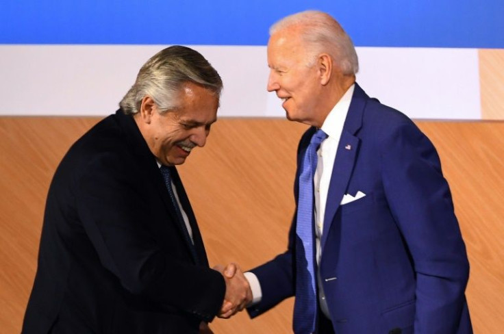 Argentina's President Alberto Fernandez shakes hands with Joe Biden after critical remarks about the US leader at the Summit of the Americas in Los Angeles